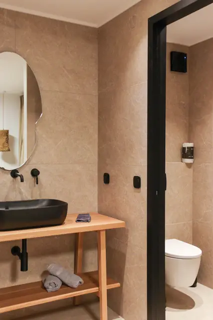 Bathroom vanity, round mirror and glass shower screen