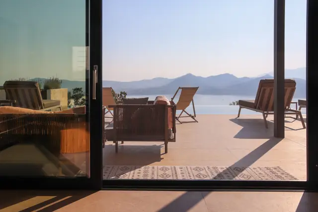View of the sea and terrace through the sliding glass doors