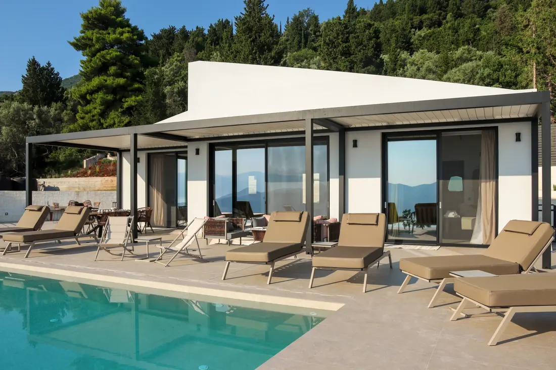 Villa Ionian Aura exterior with the pool, sun loungers and covered terrace